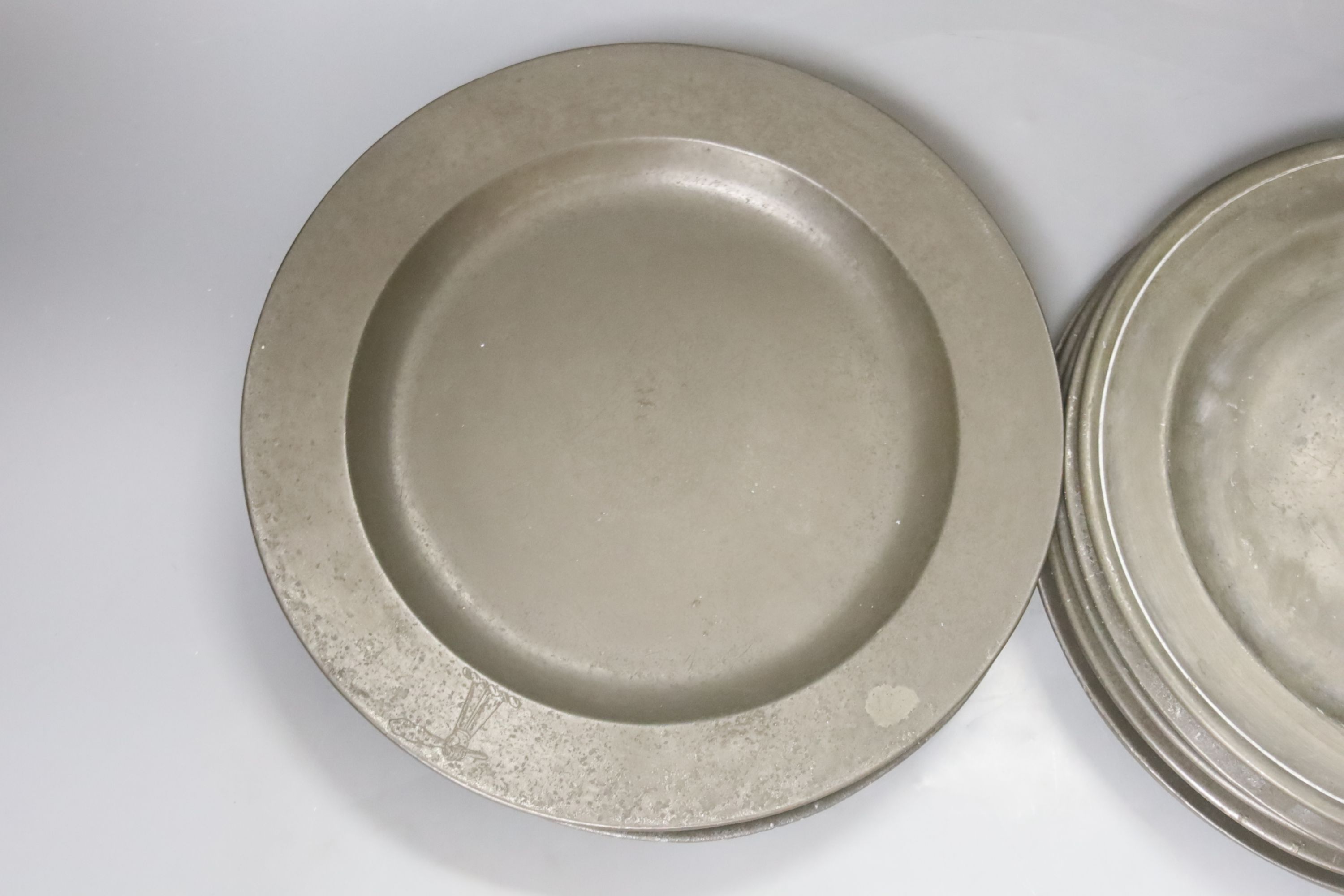 A quantity of 18th century pewter plates, London touch marks diameter 24cm